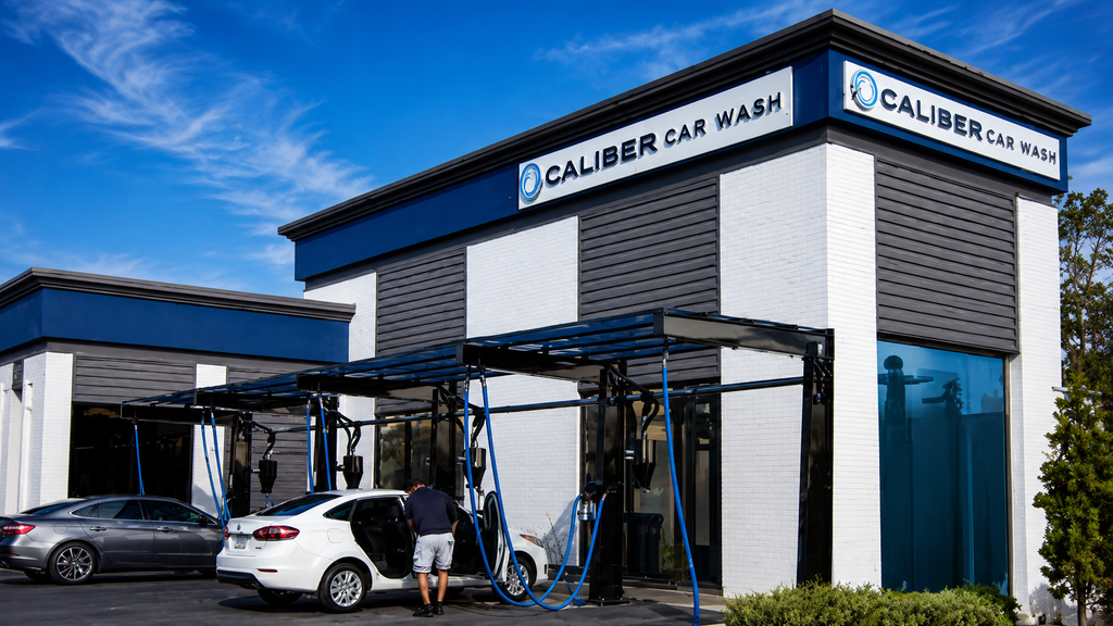 Caliber Car Wash building with self-service wash bays.